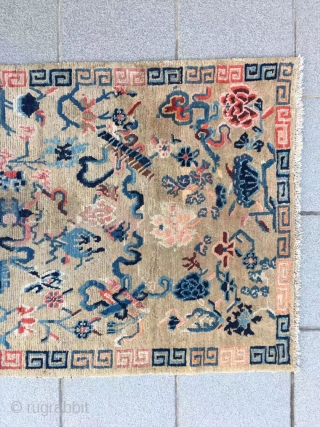 Tibet rug, light camel background with Buddha eight treasures pattern. Size 153*82cm(60*32”). Good age and condition.                 