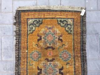 Tibet rug, yellow background with nice group flowers pattern, Lucky clouds  in the four corner. Good age and condition. Size 160*88cm(62*34”). Wool warp and weft       