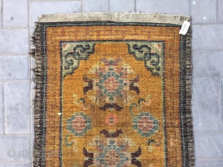 Tibet rug, yellow background with nice group flowers pattern, Lucky clouds  in the four corner. Good age and condition. Size 160*88cm(62*34”). Wool warp and weft       