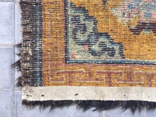 Tibet rug, yellow background with nice group flowers pattern, Lucky clouds  in the four corner. Good age and condition. Size 160*88cm(62*34”). Wool warp and weft       