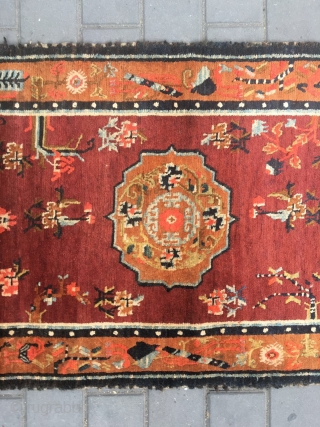 #1903 Tibet rug, red background wiht single group flower and around full of flower pattern.
good age and quality. wool warp and weft. size 165*88cm( 65*34'')        