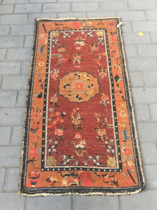 #1903 Tibet rug, red background wiht single group flower and around full of flower pattern.
good age and quality. wool warp and weft. size 165*88cm( 65*34'')        