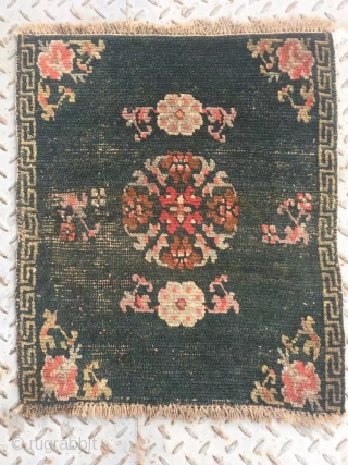 Tibet rug, very nice green color with single group flower pattern. Good age. Size 64*52cm(25*20”)                  