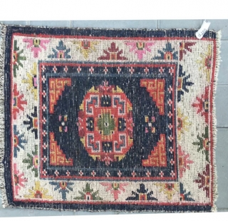 Tibet rug, blue background with nice flowers . Good age and condition. Wool warp and weft.size 63*75Cm(25*29”)                