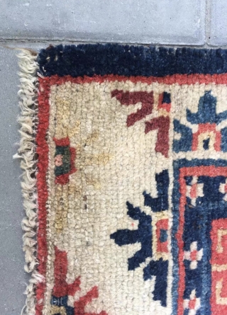 Tibet rug, blue background with nice flowers . Good age and condition. Wool warp and weft.size 63*75Cm(25*29”)                