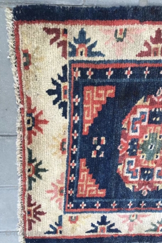 Tibet rug, blue background with nice flowers . Good age and condition. Wool warp and weft.size 63*75Cm(25*29”)                