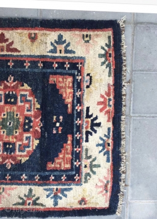 Tibet rug, blue background with nice flowers . Good age and condition. Wool warp and weft.size 63*75Cm(25*29”)                