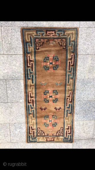 Tibetan rug, brown background with group flower veins. Good age and condition. Size 152*67cm( 59*26”)                  