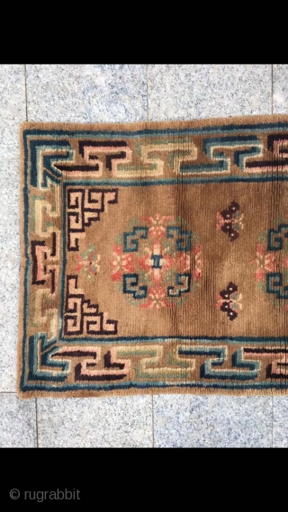 Tibetan rug, brown background with group flower veins. Good age and condition. Size 152*67cm( 59*26”)                  