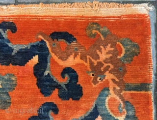 betan rug, Orange background with bat pattern, surrounded by the bat 
veins. Very nice rug, good age and condition. Size 88*60cm(34*23”)            