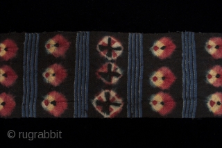 Kaabo nambu belt or sash, Tibet. These sashes are tied over a coat. Nagbu-tigma (tie-dye) on black wool. 6.5" (16.5 cm) wide by 152" (386 cm).       