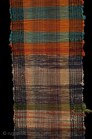 Sakiori obi, Japan. Made from old cotton fabric, this example has bands of brick red and aqua with some orange bands mixed in at the ends. One end has a more subtle  ...