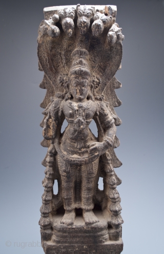 Temple carving of, most likely, Vishnu from Kerala, India.
Carved wood.
18" (45.7 cm) high, 20" (50.8 cm) with base, 5.5" (14 cm) wide
16th to 17th century
#7680        