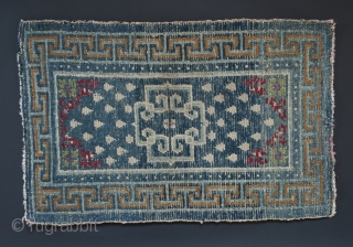 Small wool rug, Tibet. 22" (56 cm) by 35" (89 cm).
Please note: the second images of the full rug and the detail are photos of the back of the rug. They look  ...