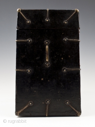 Black box, Tibet.
Wood, fabric, brass.
8" (20.2 cm) high, 10.5" (26.2 cm) wide, 5" (12.7 cm) deep.
Late 19th to very early 20th century.
This fabric-covered wood box tapers slightly toward the top, as seen  ...