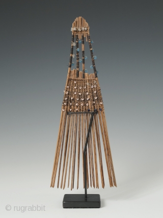 Comb (helu), Tonga. Coconut palm leaf, plant fibre, fine wire, seed beads. Mid-20th century. 7.5" (19 cm) high. Combs like this were indicative of rank and worn in the hair as ornamentation,  ...