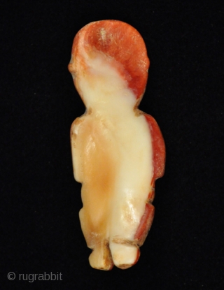 Figurine.
Inca.
Spondylus shell.
2-3/4" (7 cm) high.
A.D. 1350-1450.                           