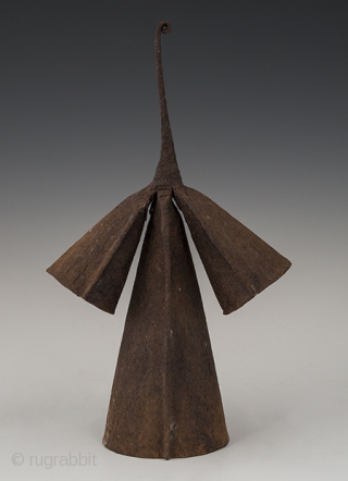 Gong currency,
Yoruba people, Nigeria.
Hand forged iron,
11" (28 cm) high and 6.75" (17 cm) wide,
Early to mid 20th century,
Very graceful anthropomorphic gong currency has two different pitches when struck.     