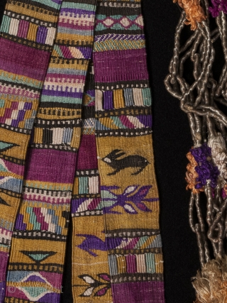 Ceremonial cinta (hair ribbon). Totonicapán, Guatemala. Cotton and silk, woven by hand on a backstrap loom. 111" by 1.25"              