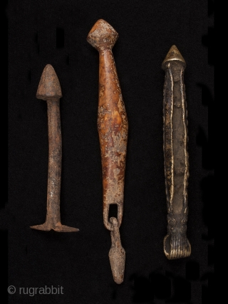 Phallus amulets,
Burkina Faso.
Iron, wood, bronze
6" (15.2 cm), 9" (23 cm) and 7.25" (18.4 cm) high.
Mid 20th century

These are either amulets of fertility or an indication of male prowess.     