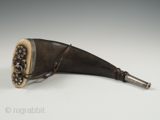 Horn snuff container, Tibet. Yak horn, silver, bone, 19th century, 9.25" (23.5 cm) long by 3" (7.5 cm) wide.              