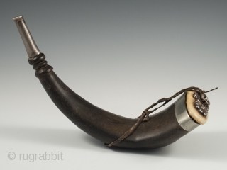 Horn snuff container, Tibet. Yak horn, silver, bone, 19th century, 9.25" (23.5 cm) long by 3" (7.5 cm) wide.              