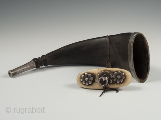 Horn snuff container, Tibet. Yak horn, silver, bone, 19th century, 9.25" (23.5 cm) long by 3" (7.5 cm) wide.              