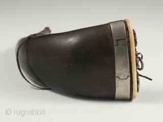 Horn snuff container, Tibet. Yak horn, silver, bone, 19th century, 9.25" (23.5 cm) long by 3" (7.5 cm) wide.              