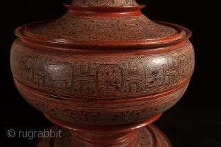 Large offering vessel, hsun ok, Pagan, Burma. Bamboo, lacquer, pigment, 33″ high by 18″ diameter (84 by 45.7 cm), Late 19th or early 20th century.

An imposing offering vessel composed of six pieces,  ...