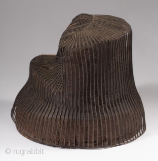 Tanggeon with base,
Korea.
Horsehair, wood,
21" (53.3 cm) in circumference, 6" (15.2 cm) high.
Late 19th to early 20th century.
The tanggeon was worn by nobility, as well as men in the commercial and medical fields.  ...