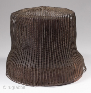 Tanggeon with base,
Korea.
Horsehair, wood,
21" (53.3 cm) in circumference, 6" (15.2 cm) high.
Late 19th to early 20th century.
The tanggeon was worn by nobility, as well as men in the commercial and medical fields.  ...