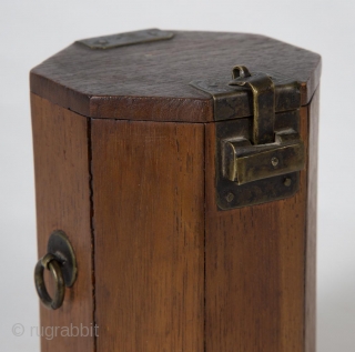 A small, unique octagonal box from Korea. 4.75" (12 cm) high by 3" (7.5 cm) wide. It opens by sliding the latch to the left, which releases the small hook. Brass hardware,  ...