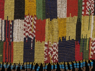 Pikuran (cache-sex),
Bana Guili people, Mandara Mountains, Cameroon.
Seed beads, cotton string, cowrie shells,
21" (53.3 cm) wide by 9" (22.8 cm) high
Mid 20th century.
These colorful cache-sex were worn for celebrations, rituals and rites of  ...