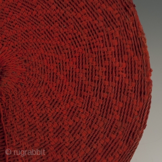 Woman's hat, Isicholo, Zulu people, South Africa. Cotton, wire, 11" (28 cm) in diameter by 3" (7.6 cm) high, Mid 20th century.
The unusual spiral weave on this cotton Isicholo makes this a  ...