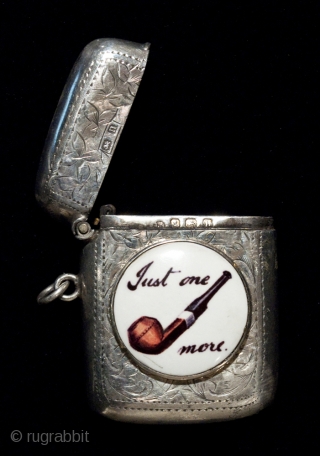 Match safe,
Unknown manufacturer, probably European.
Sterling silver, porcelain.
1 7/8" (4.7 cm) high.
c. 1895.
This unique match safe has several hallmarks: two on the outside lid and four on the inner rim. The center porcelain  ...