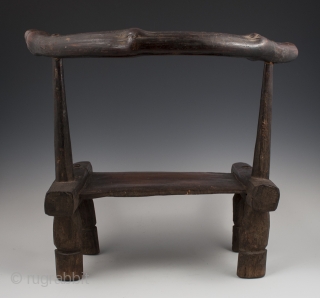 Small chair,
Dan tribe, West Africa.
15" (38 cm) high by 17.75" (45 cm) wide by 12" (30.5 cm) deep.
Mid 20th century.             