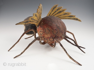 Alebrije,
Mexico City.
Paper mache over wire armature, paint,
Early to mid 20th century,
9" (23 cm) high by 15" (38 cm) long by 16" (40.5 cm) wide,
Ex. Fred and Nancy Roscoe collection, California. 	

This haunting  ...
