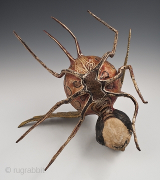 Alebrije,
Mexico City.
Paper mache over wire armature, paint,
Early to mid 20th century,
9" (23 cm) high by 15" (38 cm) long by 16" (40.5 cm) wide,
Ex. Fred and Nancy Roscoe collection, California. 	

This haunting  ...