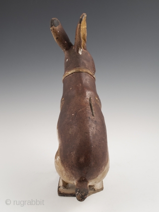 Rabbit Bank,
Tlaquepaque, Jalisco, Mexico,
Earthenware, slip decoration, glaze,
c. 1950s
11.5" (27.3 cm) high by 8.5" (18.4 cm) wide, as photographed from side
Ex. Fred and Nancy Roscoe collection, California 	

This charming, slightly eerie rabbit bank  ...