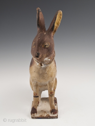Rabbit Bank,
Tlaquepaque, Jalisco, Mexico,
Earthenware, slip decoration, glaze,
c. 1950s
11.5" (27.3 cm) high by 8.5" (18.4 cm) wide, as photographed from side
Ex. Fred and Nancy Roscoe collection, California 	

This charming, slightly eerie rabbit bank  ...