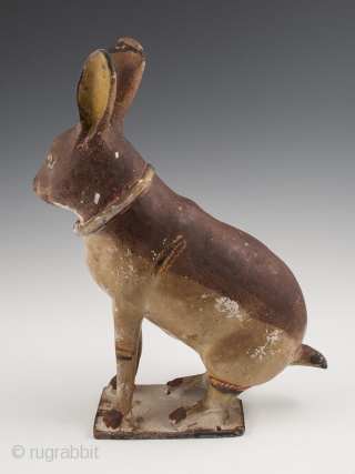 Rabbit Bank,
Tlaquepaque, Jalisco, Mexico,
Earthenware, slip decoration, glaze,
c. 1950s
11.5" (27.3 cm) high by 8.5" (18.4 cm) wide, as photographed from side
Ex. Fred and Nancy Roscoe collection, California 	

This charming, slightly eerie rabbit bank  ...