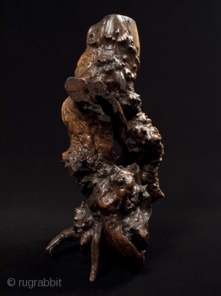 Burl candle stand,
Japan.
Burl wood.
17" (43 cm) tall.
Early to mid-20th century.
The hole in the top is 6" deep; this piece has been waxed.           