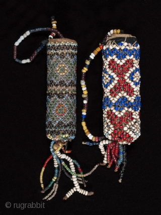 Beaded lime containers,
Timor Island, Indonesia,
Seed beads, cork, string
2.75 " (14.6 cm) and 3" (19.6 cm) high.
Early to mid 20th century. Sold separately           