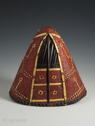 Hat, Naga People, Kalyo-Kengyu eithnic group, Northeastern India. Cane, orchid straw, 8″ (20 cm) high by 8.25″ (21 cm) by  5.5" (14 cm). A red-dyed woven cane conical-shaped warrior's hat has  ...