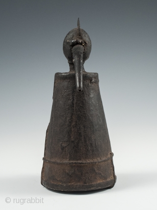 Iron jeweler's torch, Karnataka, South India, 7" (17.7 cm) high, late 19th to early 20th century. These torches often took avian form and this odd bird has quite a unique presence.
  