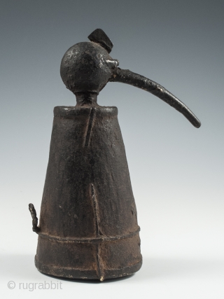 Iron jeweler's torch, Karnataka, South India, 7" (17.7 cm) high, late 19th to early 20th century. These torches often took avian form and this odd bird has quite a unique presence.
  