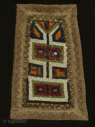A traditional apron, called a "podia", traditionally worn by married women of the Sarakatsani, a formerly nomadic tribe of northern Greece.  The central area is usually cross-stitched, but this example has  ...