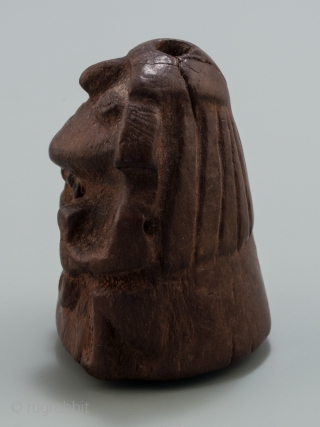 Stargazer shaman lime container,
Huari, Peru.
Wood,
1.75" (4.5 cm) high.
A.D. 700-1000.

This lime container depicts a 'stargazer' shaman holding the tools of his trade. Lime containers were personal items and a 'kill hole' was made  ...