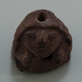 Stargazer shaman lime container,
Huari, Peru.
Wood,
1.75" (4.5 cm) high.
A.D. 700-1000.

This lime container depicts a 'stargazer' shaman holding the tools of his trade. Lime containers were personal items and a 'kill hole' was made  ...