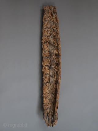 War shield,
Paduko tribe, Chad, Central Africa.
Reed, hide,
42" (106.7 cm) by 6.5" (16.5 cm)
c. 1900
Custom metal wall mount included.
Ex Fifi White, California.            